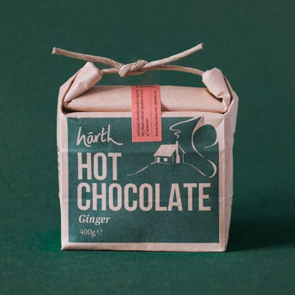 Box of hārth hot chocolate ginger on a green background