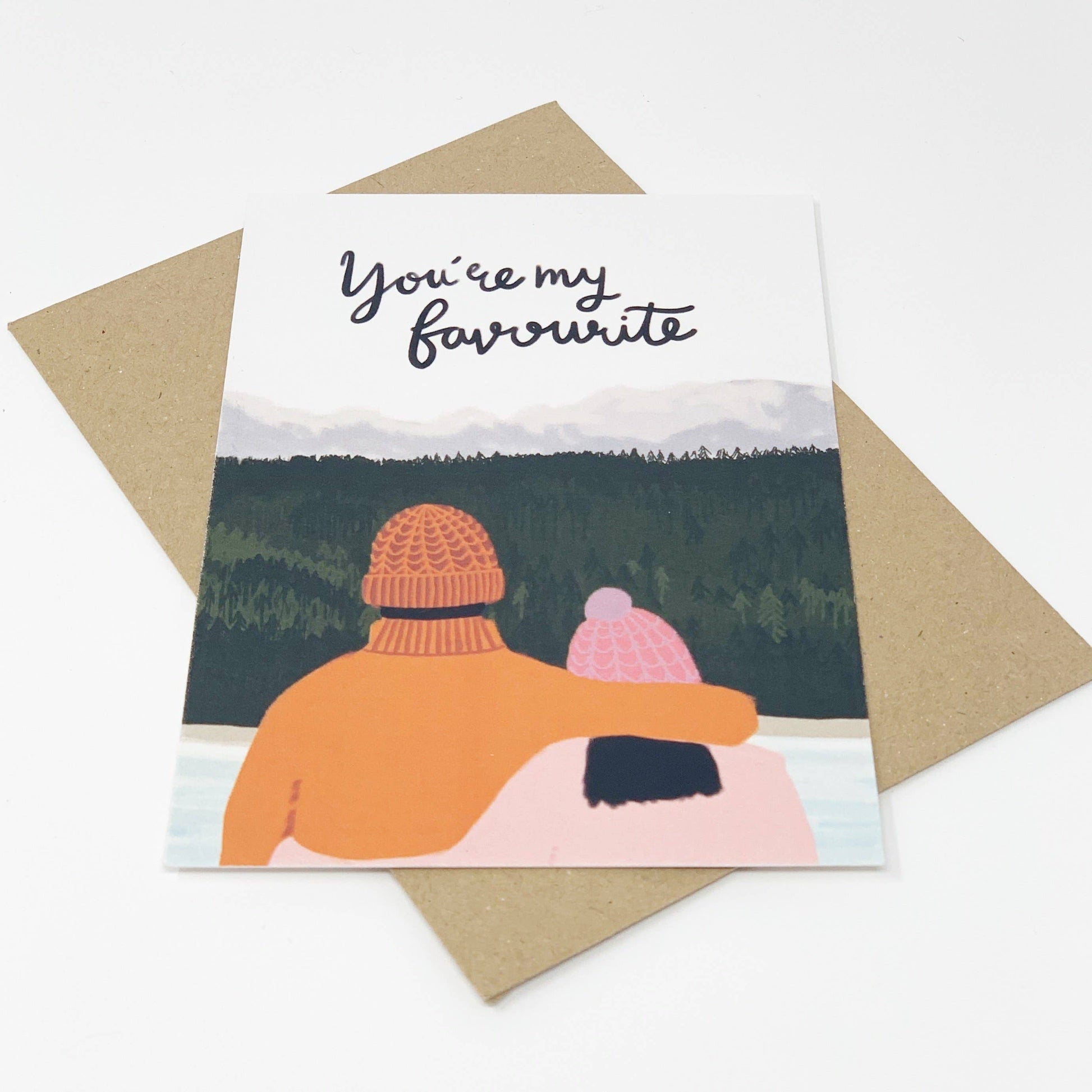 Card with illustration of two people hugging and text 'You're my favourite' on a scenic background.