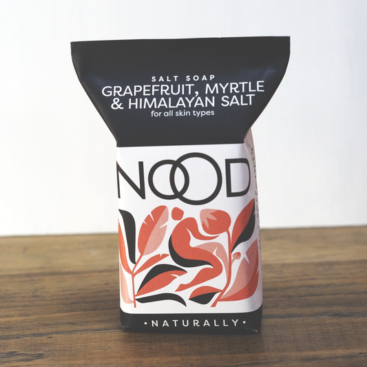 A bar of soap with packaging that has the text 'Grapefruit, Myrtle & Himalayan Salt' and the brand name 'NOOD' prominently displayed.