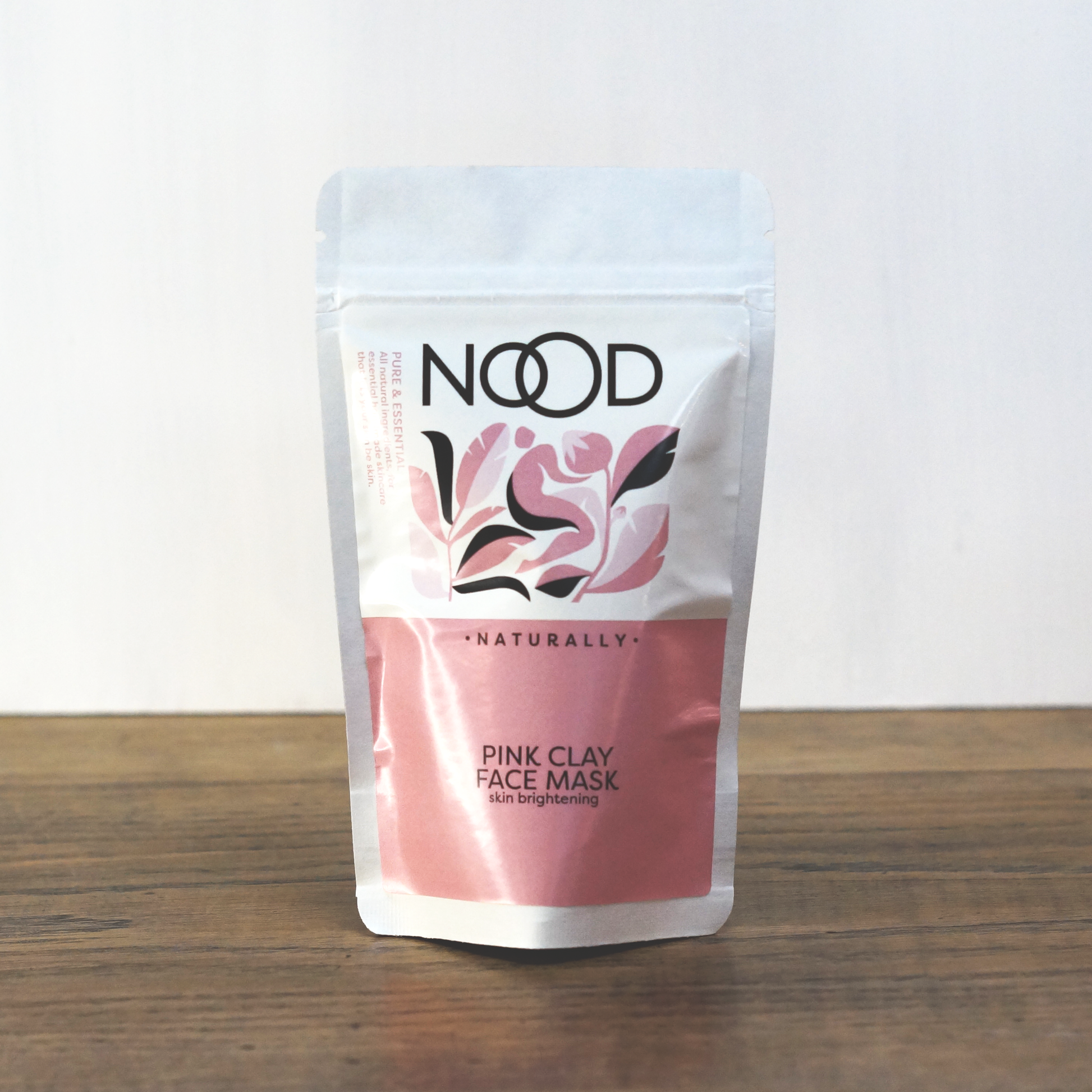 A small, wrapped bag of Fullers Earth Pink Clay from NOOD Stores.