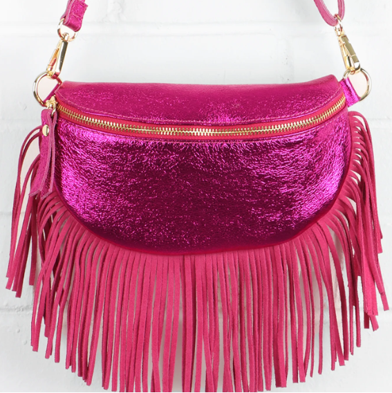 Pink fringed handbag with gold zipper on a white background