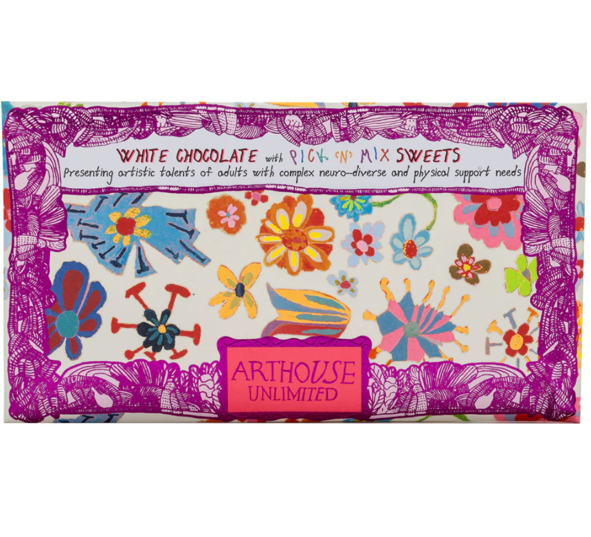 Colorful packaging of white chocolate with mix sweets by Arthouse Unlimited on a white background