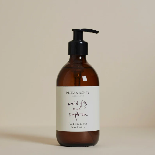 Brown bottle of Plum & Ashley wild fig and saffron hand and body wash on a beige background
