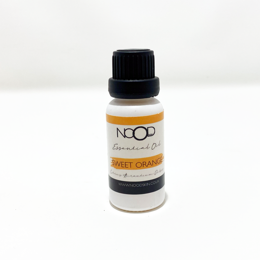 A bottle of NOOD Sweet Orange Essential Oil with a dropper, on a white background.
