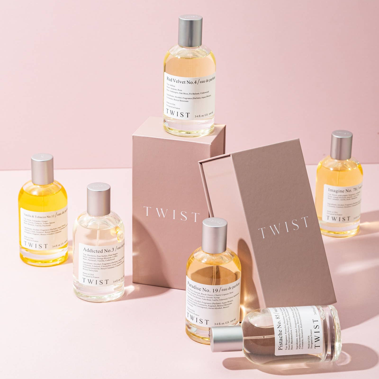 Collection of Twist skincare products on a pink background