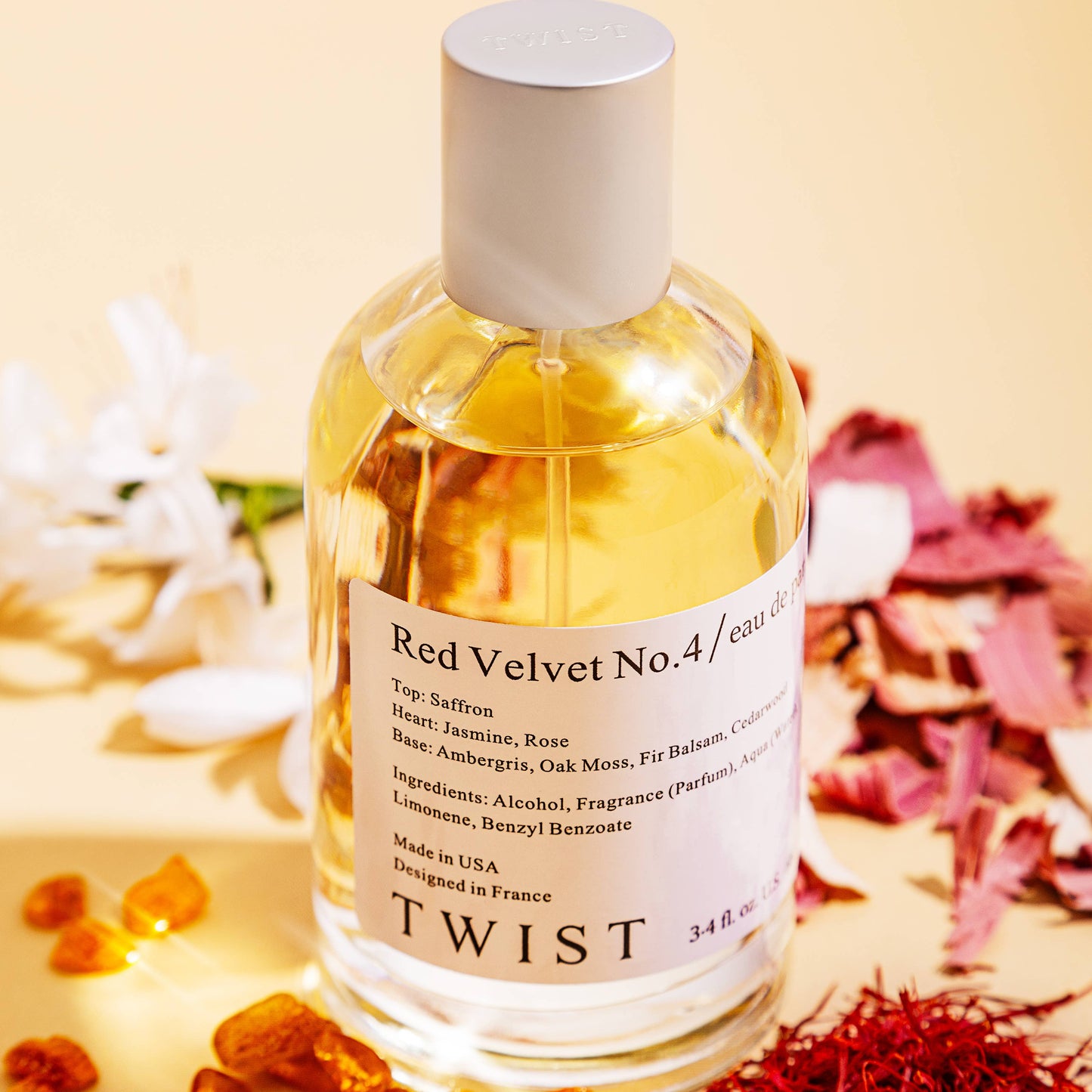 Bottle of 'Red Velvet No.4' by TWIST with decorative elements on a light background