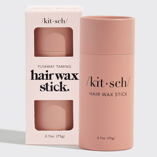 Kit Sch hair wax stick with packaging on a light gray background
