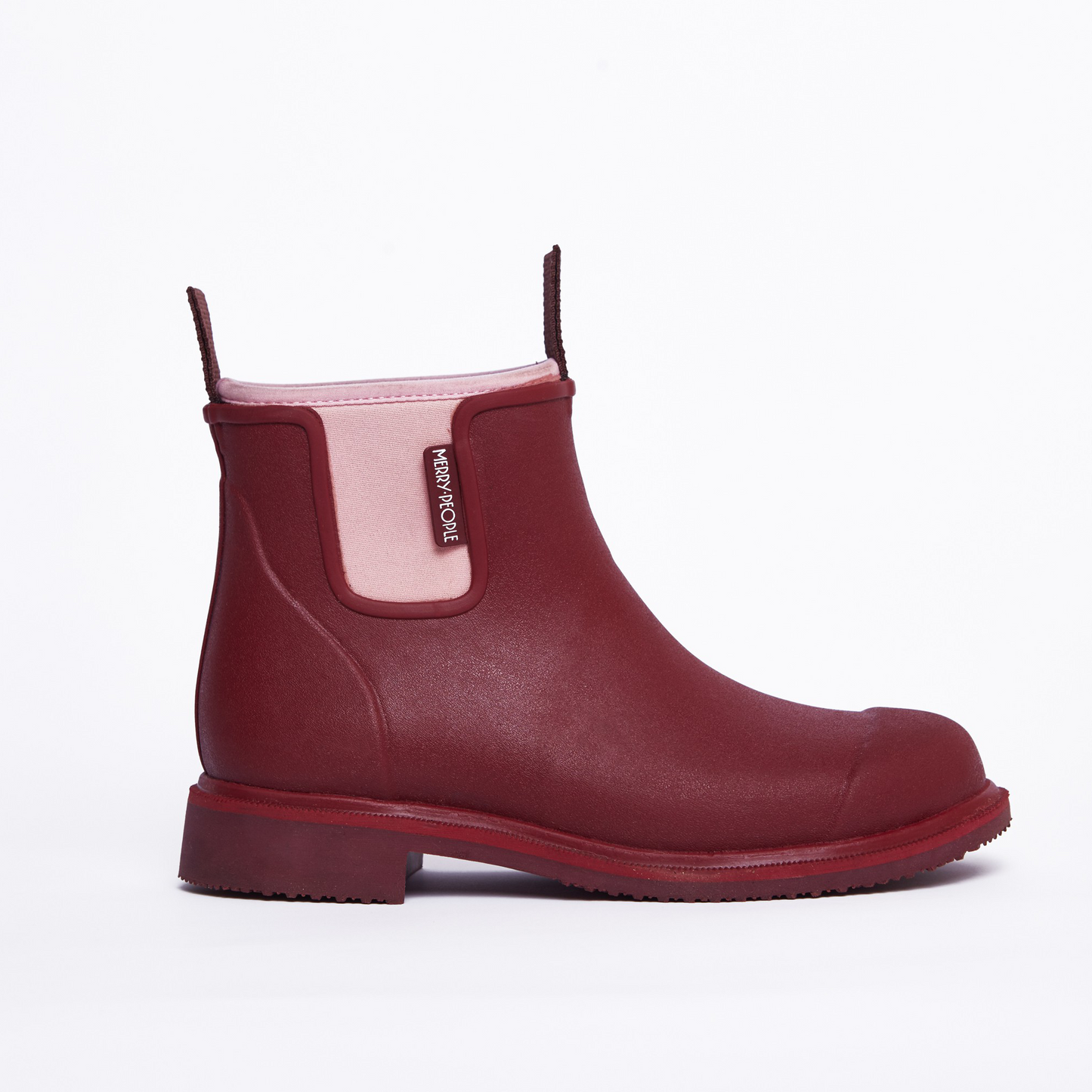 Red rain boot with pink inner lining on a white background