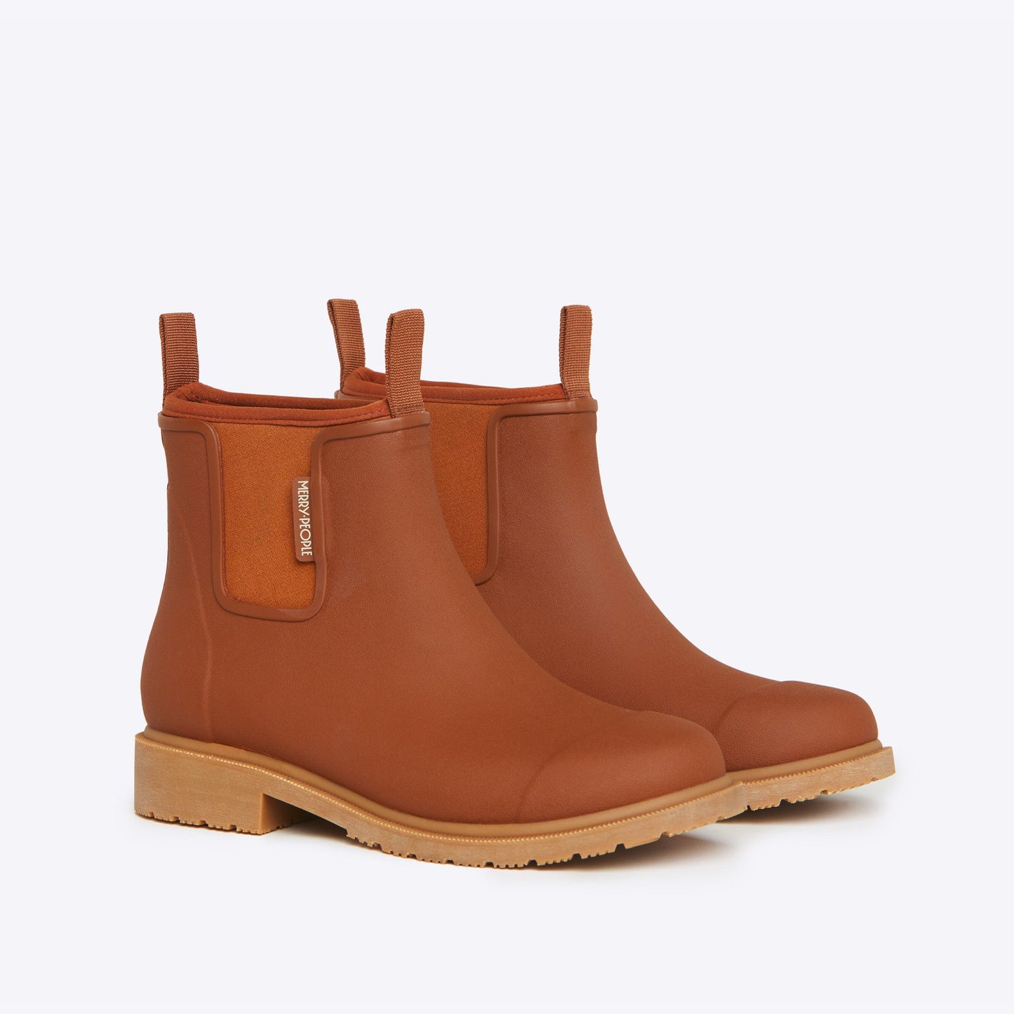Pair of brown rain boots on a white background