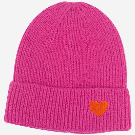 Pink beanie with a red heart on a white background