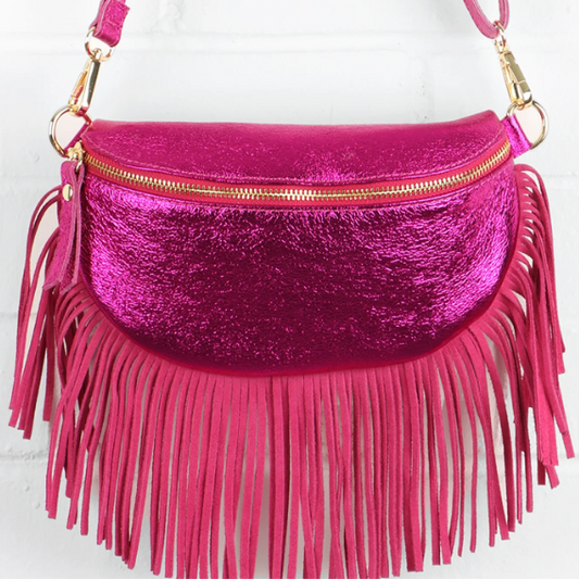 Pink fringed handbag with gold zipper on a white background
