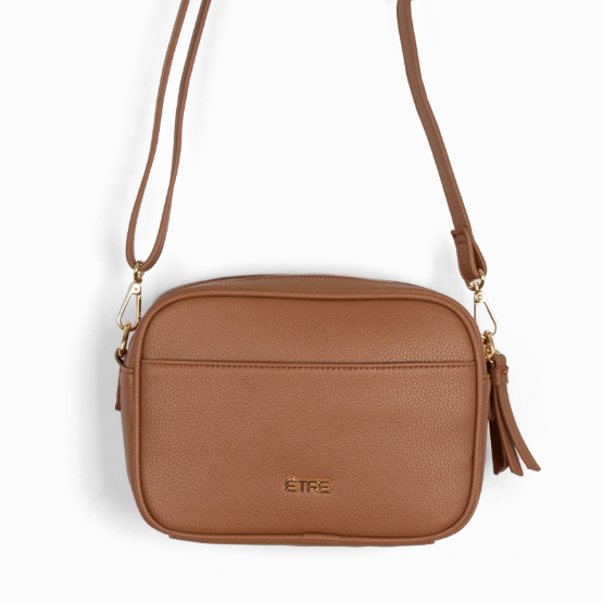 Brown crossbody bag with a strap on a white background