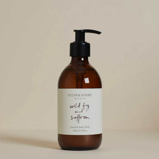 Brown bottle of Plum & Ashley wild fig and saffron hand and body wash on a beige background